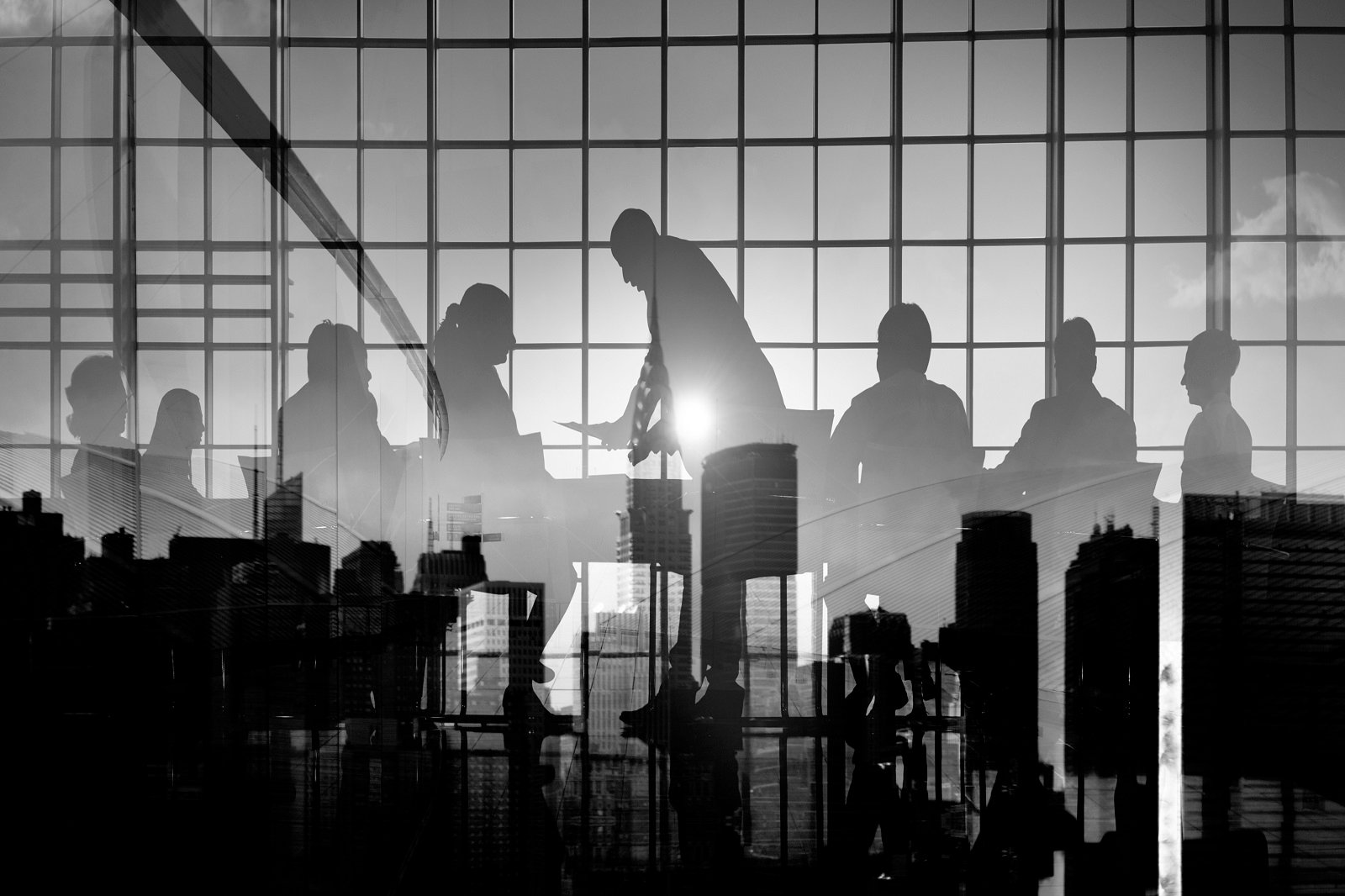 silhouette-business-people-discussion-meeting-cityscape-team-concept